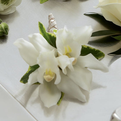 White Mini Cymbidium Boutonniere –  Heartfield Florist, Huntsville TX